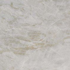 a white marble textured surface with light brown streaks