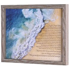 an image of the ocean and beach with a poem written in wood frame on it