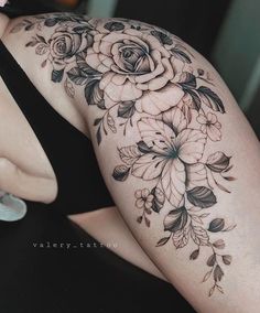 a woman's arm with flowers on it