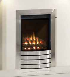 a modern fireplace with flames burning in it's side and the top panel is shiny silver