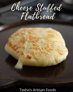 cheese stuffed flatbread on a plate with text overlay that reads, tash's artisan foods