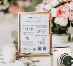 a table with a sign and camera on it