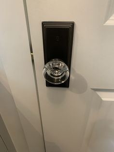 an open door with a glass knob on it