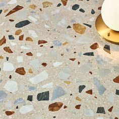 a close up of a counter top with different colored rocks on it