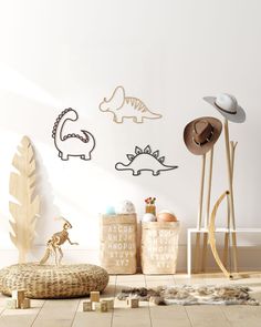 the dinosaur wall decals are on display in this children's room, along with toys