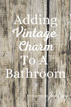 an old wooden fence with the words adding vintage charm to a bathroom written on it