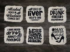 four coasters with different sayings on them sitting on top of a wooden table