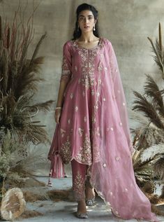 This set features a short onion silk anarkali suit with organza dupatta and potli. Fabric: Silk Color: Pink Care: Dry Clean Only Silk Anarkali Suits, Walima Dress, Silk Anarkali, Embroidered Anarkali, Anarkali Dress Pattern, Pakistani Fashion Party Wear, Traditional Indian Outfits, Designer Party Wear Dresses, Designer Dresses Casual