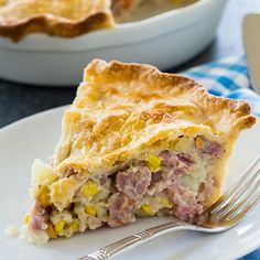 a piece of pie sitting on top of a white plate