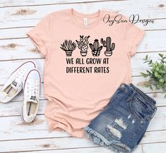 "We All Grow At Different Rates Teacher Shirt, Teacher Tees, Gift For Teacher Kindergarten Elementary Teacher T-Shirts , Funny Teacher Shirt HOW TO ORDER 1. Select the shirt \"Style and Size\" 2.Select the shirt Color 3. Enter what would you like to say on your t shirt and LETTERING color 4.Select the quantity. 5. Click Add to cart. If you have any difficulties, send us a message. Processing Time and Shipping The standard processing time is 1-3 business days. We usually proses and ship out the o We All Grow At Different Rates, Funny Teacher Shirts, Funny Teacher Shirts Zazzle, Trendy Screen Print T-shirt For Teacher Appreciation, Fun Graphic Print T-shirt For Teacher Appreciation, Fun Custom Print T-shirt For Teacher Appreciation, Fun Teacher Appreciation T-shirt With Graphic Print, Funny Mom Shirts, Teacher Tees