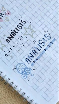 a spiral notebook with the words analis on it and an arrow in the middle