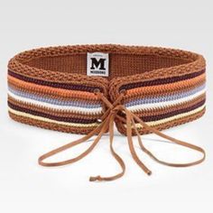 the multicolored belt is tied up and ready to be worn