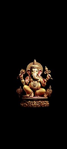 an elephant statue sitting on top of a wooden stand in front of a black background