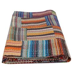 a multicolored blanket folded on top of each other