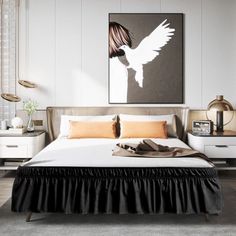 a bedroom with a bed, nightstands and pictures on the wall above it that have been decorated in black and white