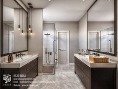 a large bathroom with two sinks and mirrors