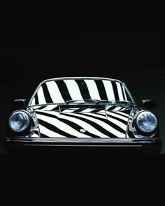 a black and white car with zebra stripes on it