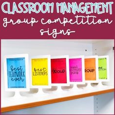 the classroom management group competition sign is displayed in front of a row of colorful books