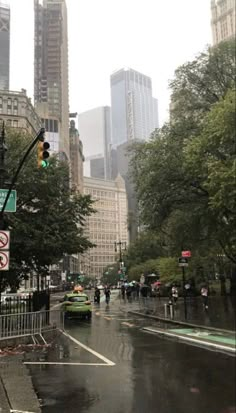 a city street filled with lots of traffic and tall buildings