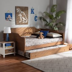 a child's bedroom with a bed, nightstands and stuffed animals on the floor