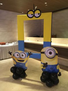 two inflatable despicable minion figures sitting on top of a table