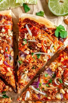 two slices of mexican pizza with meat, onions and cilantro on parchment paper