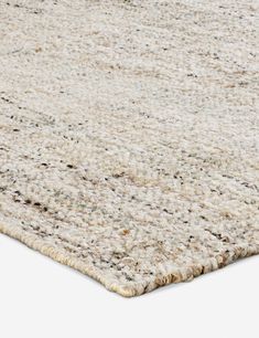 an area rug that has been placed on top of a white surface with black dots