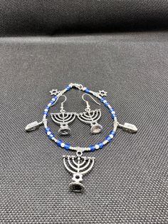 "Hanukkah Charm bracelet and earrings.  Can be purchased together or separate.  Bracelet is 8 1/4\" long." Holiday Bracelets, White Bracelets, My Wife Is, Christmas Earrings, Hanukkah, Etsy Earrings, Jewelry Bracelets, Handmade Items, Charm Bracelet