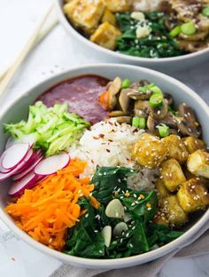 two bowls filled with different types of food