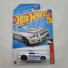 a hot wheels white car with checkered stripes on the front and back sides is shown