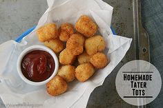 fried tater tots with ketchup in a bowl