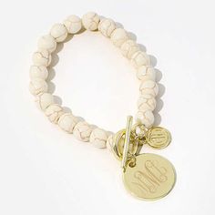 Check out this monogrammed bracelet with a 7/8 inch monogrammed charm and fun beads! This bracelet is perfect for those casual days or a dressy night on the town! The gold, silver and ivory bracelets are elastic so they stretch to fit almost any wrist, making it a perfect personalized gift idea for all the special women in your life!​Made of brassMarble made of brass and white turquoiseMeasures approximately 7 inchesNickel FreeMarble bracelet is not elastic Adjustable White Monogram Jewelry, Marley Lilly, Night On The Town, Ball Bracelet, Customized Gifts, Jewelry Shop, Free Gifts, Personalized Gifts, Jewelry Bracelets