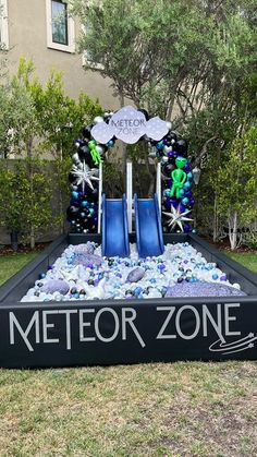 a sign that says met for zone with blue chairs and snowflakes on it