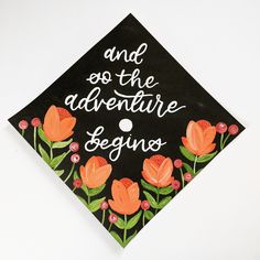 "Every cap is hand painted, so remember they're sisters, not twins :) Ready to ship graduation cap topper with \"and so the adventure begins\" and floral painting. Please see https://www.etsy.com/listing/683745657/custom-graduation-cap-topper-hand?ref=listings_manager_grid listing if wanting a custom graduation cap topper by me. GRADUATION CAP IS NOT SUPPLIED BY ME. You will receive a piece of card stock that you can attach to your own cap. Details- Size: About 9.5 by 9.5\" Cap Color: Black To a Grad Cap Simple, Painted Grad Cap, Custom Graduation Caps, Child Life Specialist, Grad Hat, Grad Ideas, Grad Caps, The Adventure Begins, Graduation Cap Toppers