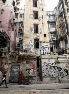 an old building with graffiti all over it