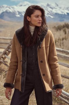 Inspired by a timeless classic, the Abby sheepskin coat from our Heritage Collection is elegantly crafted to endure for many years. It is outfitted with a luxurious shawl collar that will envelop you in warmth on the coldest days, and features all the classic details, such as roll-back cuffs and a comfortable tailored fit, that will make it among your all-time favorites. Classic Long Fur Coat For Fall, Classic Sheepskin Fur Coat For Winter, Classic Long Fur Coat For Workwear, Elegant Sheepskin Fur Coat For Winter, Classic Formal Fur Coat For Fall, Elegant Sheepskin Outerwear For Fall, Elegant Sheepskin Fur Coat For Work, Classic Fur Coat For Work In Fall, Elegant Shearling Outerwear For Fall