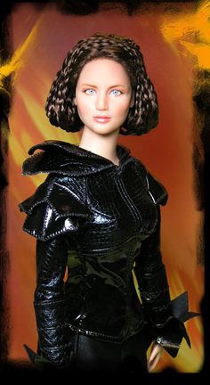 a barbie doll wearing a black dress with braids