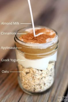 a jar filled with oats and cinnamon on top of a wooden table