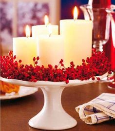 a table topped with a cake covered in candles