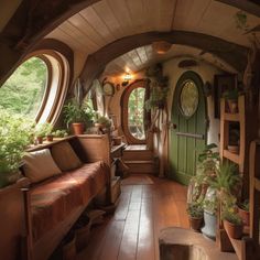 a living room filled with furniture and lots of plants on the windows sills