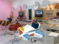 a toy airplane sitting on top of a white floor in a room filled with toys