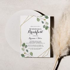 the wedding breakfast program is displayed next to a white plate and pamylon feathers