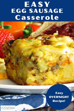 an egg sausage casserole on a plate with strawberries