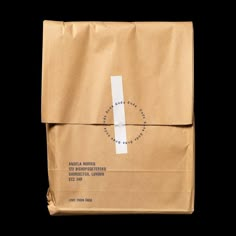 a brown paper bag on a black background