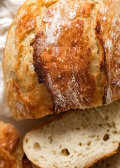 two loaves of bread sitting next to each other