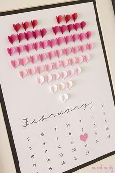 a calendar with hearts cut out of it for valentine's day on the wall