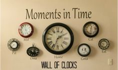 there are many clocks on the wall and one is saying,'moments in time '