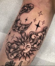 a sun and moon tattoo on the arm