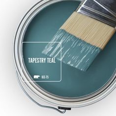 a can of teal paint with a brush in it and the words tapesty teal