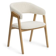 an upholstered chair with wooden legs and a white fabric seat pad on the back